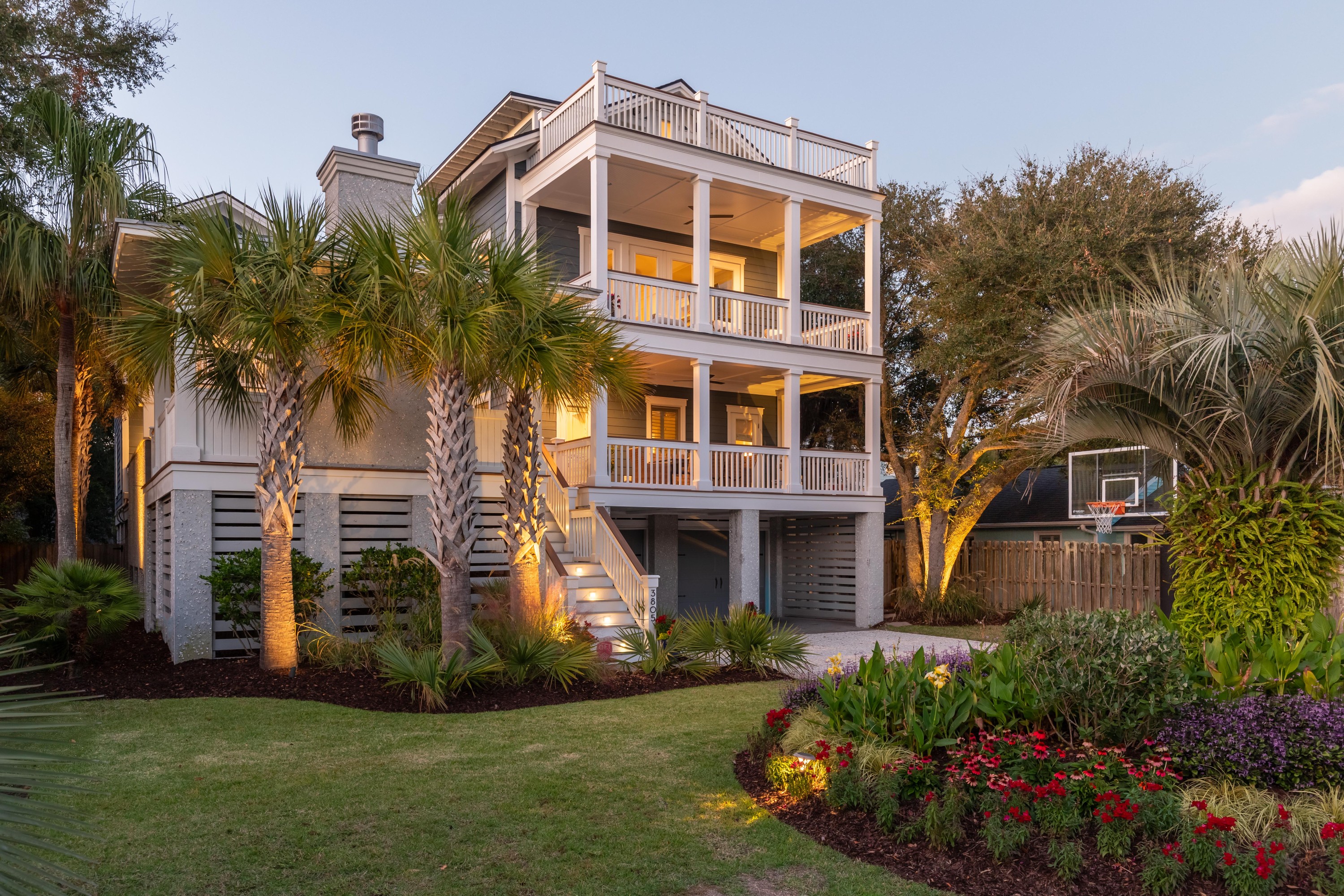 Sunset view from a property with an outdoor fire pit and swimming pool
